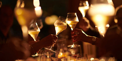 People clinking glasses of chilled champagne at a party